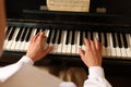 Young woman playing piano, closeup. Music lesson Royalty Free Stock Photo