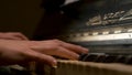 A young woman playing piano closeup. Piano hands pianist playing Musical instruments details with player hand closeup Royalty Free Stock Photo