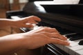 Young woman playing piano, closeup. Music lesson Royalty Free Stock Photo