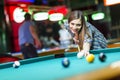 Young woman playing pool Royalty Free Stock Photo