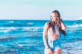 Young woman playing in the sea.woman enjoying in sea water .Cheerful young woman having fun on the summer beach