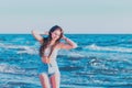 Young woman playing in the sea.woman enjoying in sea water .Cheerful young woman having fun on the summer beach