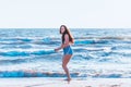 Young woman playing in the sea.woman enjoying in sea water .Cheerful young woman having fun on the summer beach