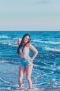 Young woman playing in the sea.woman enjoying in sea water .Cheerful young woman having fun on the summer beach