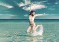 Young woman playing in the sea. Royalty Free Stock Photo