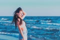 Young woman playing in the sea.woman enjoying in sea water .Cheerful young woman having fun on the summer beach