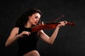 Young woman playing violin Royalty Free Stock Photo