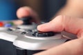 Young woman plays video game using a gamepad Royalty Free Stock Photo