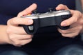 Young woman plays video game using a gamepad Royalty Free Stock Photo