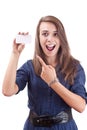 Young woman pointing at blank card in her hand Royalty Free Stock Photo