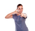 Young woman pointing-looking at you saying call me Royalty Free Stock Photo