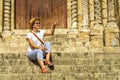 Woman pointing at view, Coimbra, Portugal, Igreja de Santiago