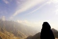 Young woman portrait in astonishing mountain view in Saudi Arabia