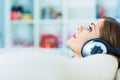 Young woman portrait with headphones music listeni