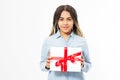 Young woman portrait hold gift box in christmas color style . Smiling happy black girl on white background Royalty Free Stock Photo