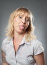 Young woman portrait, sticking out her tongue Royalty Free Stock Photo