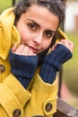 Young woman portrait in yellow coat fall Royalty Free Stock Photo