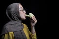 Young woman pose eating durian fruit