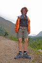 Young woman is posing against the backdrop of a beautiful view, Annapurna trekking, Nepal