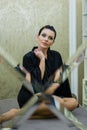 Young woman posing in black silk bathrobe. sexy housewife concept. Girl in a black bathrobe indoors. Beauty saloon Royalty Free Stock Photo