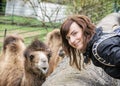 Young woman posing with camel Royalty Free Stock Photo