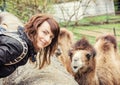 Young woman posing with camel, yellow filter Royalty Free Stock Photo