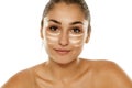 Concealer under her eyes Royalty Free Stock Photo