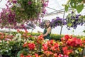 Young woman posing in floral greenhouse