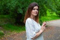 Young woman posing on forest background