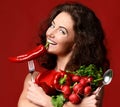 Young woman posing with fresh red vegetables radish pepper green Royalty Free Stock Photo