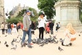 Young woman posing with pigeons