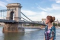 Young woman posing at Szechenyi Chain Bridge at Budapest Royalty Free Stock Photo