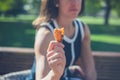 Young woman with potato wedge