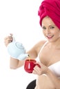 Young Woman Pouring Tea from a Teapot Royalty Free Stock Photo