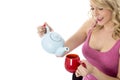 Young Woman Pouring Tea from a Teapot Royalty Free Stock Photo