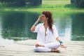 Young woman practice yoga breathing techniques outdoor
