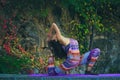 Young woman practice yoga outdoor colorful autumn background