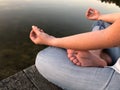 Young woman practices yoga and meditates in the lotus position Royalty Free Stock Photo