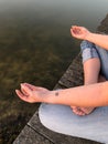 Young woman practices yoga and meditates in the lotus position Royalty Free Stock Photo