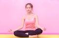 Young woman practices yoga and meditates in the lotus position Royalty Free Stock Photo