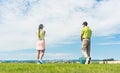 Young woman practicing the correct move during golf class outdoors