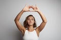 Young woman practicing meditation at the office, online yoga classes, taking a break time for a minute. Royalty Free Stock Photo