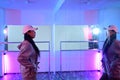 Young woman practicing performance dance in front of a large mirror at studio with neon light Royalty Free Stock Photo