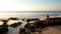 Young woman practicing yoga. Bhudjangasana, Cobra pose on the beach. Sunset time. Tegal Wangi beach, Bali Royalty Free Stock Photo