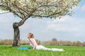 Young woman is practicing yoga, doing Cobra exercise, Bhujangasana pose Royalty Free Stock Photo