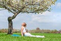 Young woman is practicing yoga, doing Cobra exercise, Bhujangasana pose Royalty Free Stock Photo