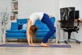 Young woman practicing yoga at home, doing inversion pose Royalty Free Stock Photo