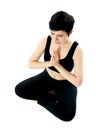 Young woman practicing yoga in the lotus position Royalty Free Stock Photo