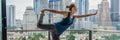 Young woman is practicing yoga in the morning on her balcony with a panoramic view of the city and skyscrapers BANNER, long format Royalty Free Stock Photo