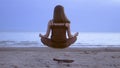 Girl meditating by the sea